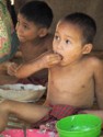 Little boy eating rice